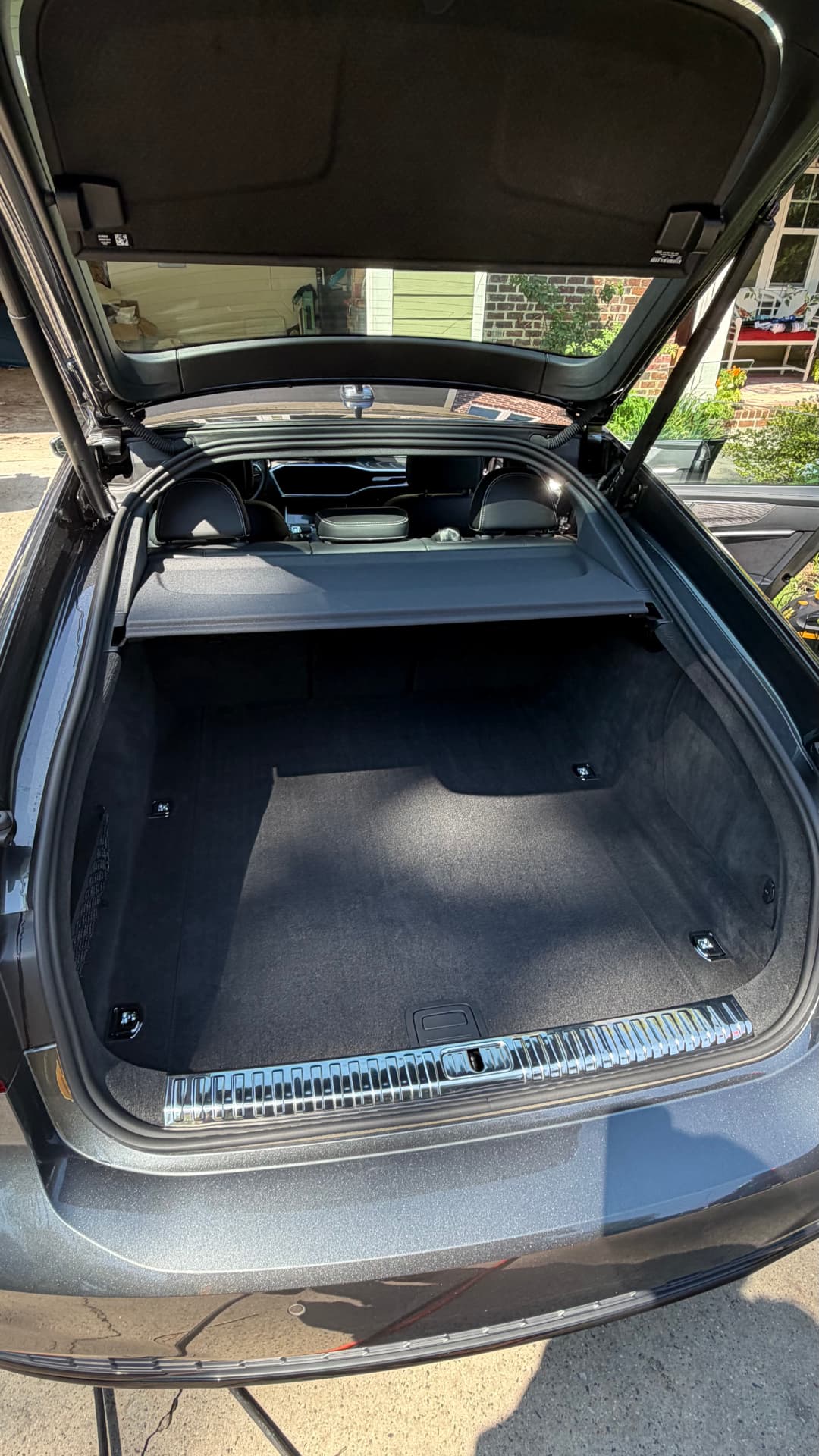 Audi A7 trunk vacuumed and cleaned after an interior detail