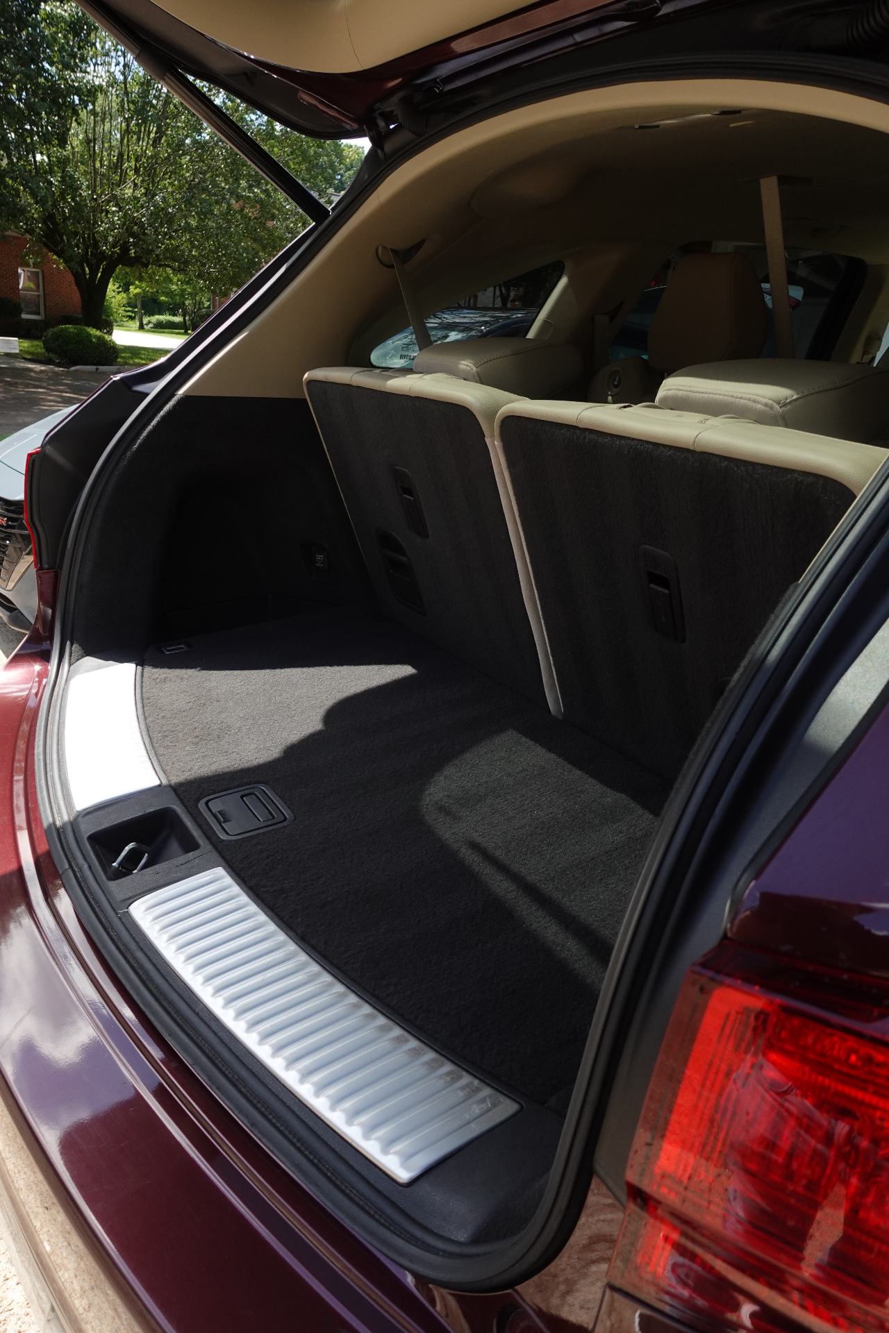 Acura MDX rear cargo area cleaned and vacuumed with folded third-row seats ready for use