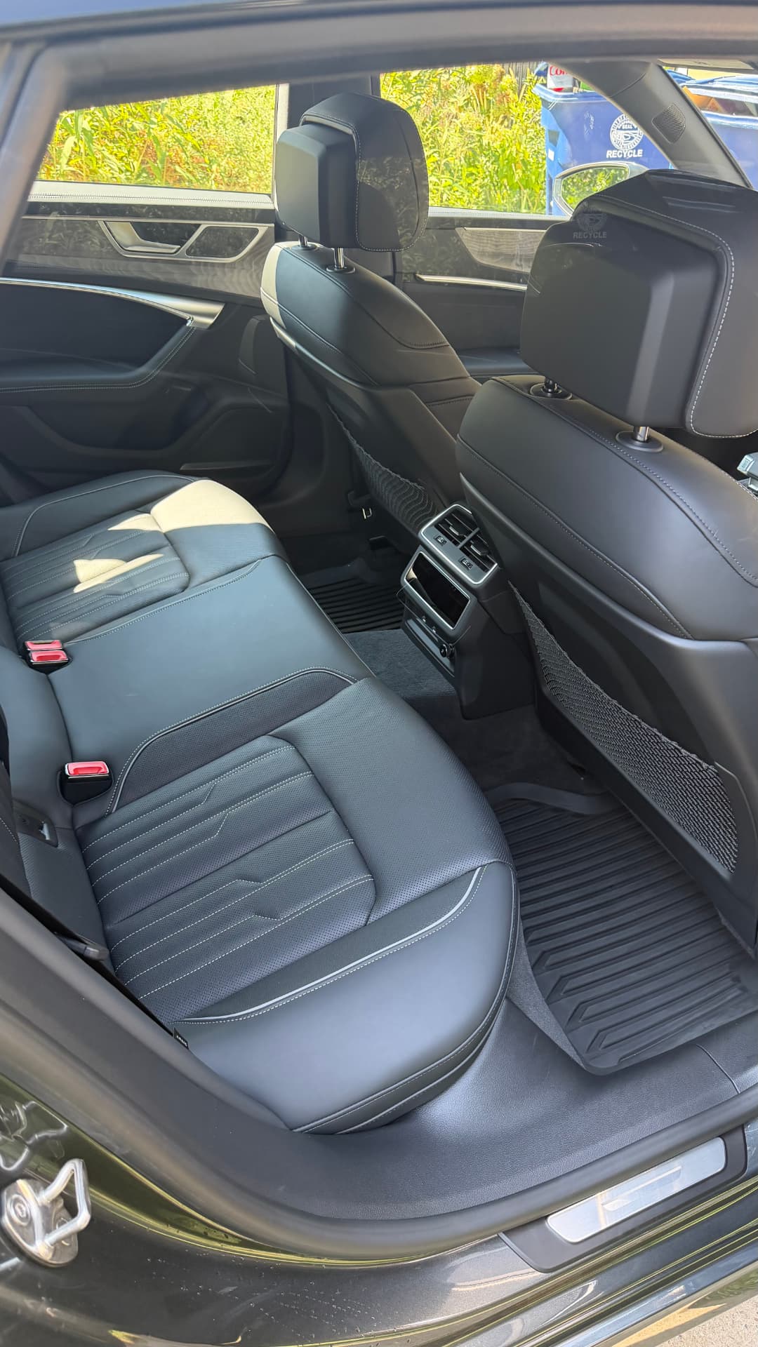 Audi A7 rear leather seats and floor mats after an interior detail